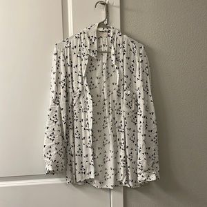 White and black button down blouse.